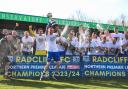 Radcliffe captain Nicky Adams lifts the NPL Premier Division trophy watched by teammates Picture: Barkley Costello