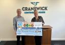Phil Fellone, from the Made In Bury team, and draw winner Laura McMahon with her giant cheque
