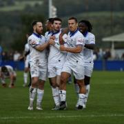 Bury FC players celebrate a goal during Tuesday night’s 2-1 win at Padiham Picture: Phil Hill