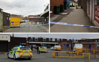 Police in Bury after the triple stabbing near Bury Market