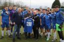Steve Wilkes celebrates 1200 games in charge as a manager with Ramsbottom United players and staff Picture: Leo Michaelovitz
