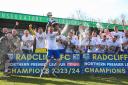 Radcliffe captain Nicky Adams lifts the NPL Premier Division trophy watched by teammates Picture: Barkley Costello