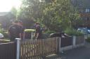 Police carried out a search of the street with officers seen combing gardens on May 24