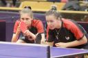 READY FOR ACTION: Bolton's Megan Gidney, left, in action with her doubles partner, Denise Payet. Pictures courtesy of ITTF