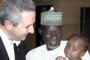 Hope for Africa — Ivan Lewis meets a young patient and his dad at the Unguwar Sanusi clinic in Kaduna, Nigeria