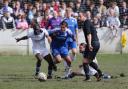 Tom Walker battling away in Ramsbottom United's 0-0 draw with Bury Picture: Leo Michaelovitz