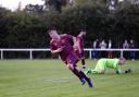 Matty Williams wheels away in celebration after scoring the first goal for the phoenix club