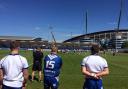 Broncos players and coaching staff look on as Bury lose to Manchester Rangers in the shadow of the Etihad Stadium
