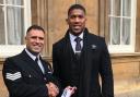 AWARD: Sgt Abed Hussain with Anthony Joshua at Buckingham Palace, receiving his Queen's Police Medal