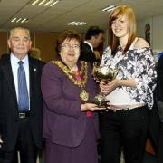 PRIZEGIVING: From left are retired headteacher Alan Scott; chairman of governors Jack Kenneford; Mayor of Bury Cllr Sheila Magnall; winner of the Nugent geography trophy, student Helen Bradshaw; and new headteacher Brian Duffy
