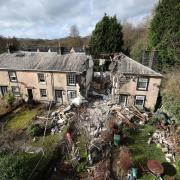 The scene in Ramsbottom, Bury, Greater Manchester, where the body of a woman has been found after a house collapsed on Wednesday evening. Picture date: Thursday February 18, 2021.