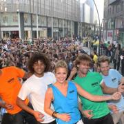 AIR GUITAR ACT: Actress Gemma Atkinson leads the world record attempt on The Rock opening day