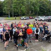 Prestwich Plodders at Heaton parkrun with the award
