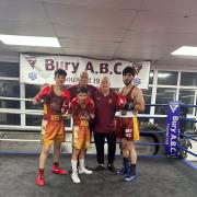 Bury ABC fighters, from left, Amaani Afsar, Zade Afsar and Zakir Khan with club coaches Mick Jelley and Colin Carr