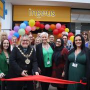 Mayor Cllr Sandra Walmsley cutting the ribbon for the opening of Bury NeighbourHub