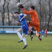 Ramsbottom United’s Matty Birchall is foiled by the AFC Liverpool keeper Picture: Leo Michaelovitz