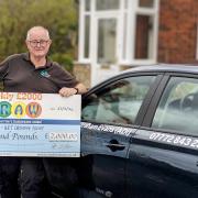 Specialist driving instructor Graham Evans with his Made In Bury giant cheque