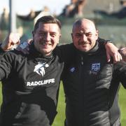 Radcliffe joint managers Anthony Johnson and Bernard Morley celebrate winning the title and promotion to National League North Picture: Radcliffe FC