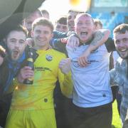 Radcliffe captain Nicky Adams and goalkeeper Mateusz Hewelt celebrate with supporters