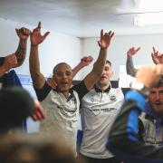 Radcliffe celebrate in the changing room after winning the league title Picture: Barkley Costello