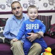 Mohammed Munir, from Prestwich, who has one arm, was holding his 20-month-old son Naveed when he was robbed of £3,000.