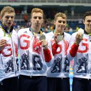 James Guy (right) claims Olympic silver in the 4x200m freestyle relay