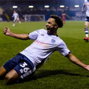 Bury forward Nicky Maynard celebrates after being involved in scoring the winning goal during the Sky Bet League 2 match between Bury FC and MK Dons. Picture by Andy Whitehead