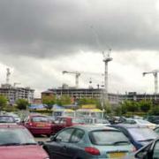 WORK UNDER PROGRESS: A view of the cranes spanning the skyline above the Rock Triangle development in Bury town centre