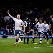 Bury defender Scott Wharton celebrates scoring Bury's third goal. Picture by Andy Whitehead