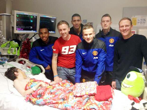 Bury Times: United stars Anderson, Chris Smalling, Tom Cleverley and Phil Jones and Coronation Street star Antony Cotton at Josh’s bedside