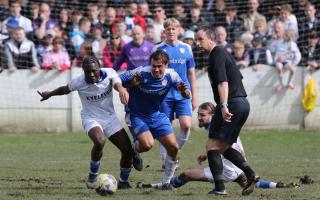 Tom Walker battling away in Ramsbottom United's 0-0 draw with Bury Picture: Leo Michaelovitz