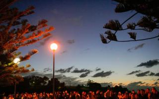 Crowds attend the Anzac Day dawn service at Coogee Beach in Sydney (Mark Baker/AP)