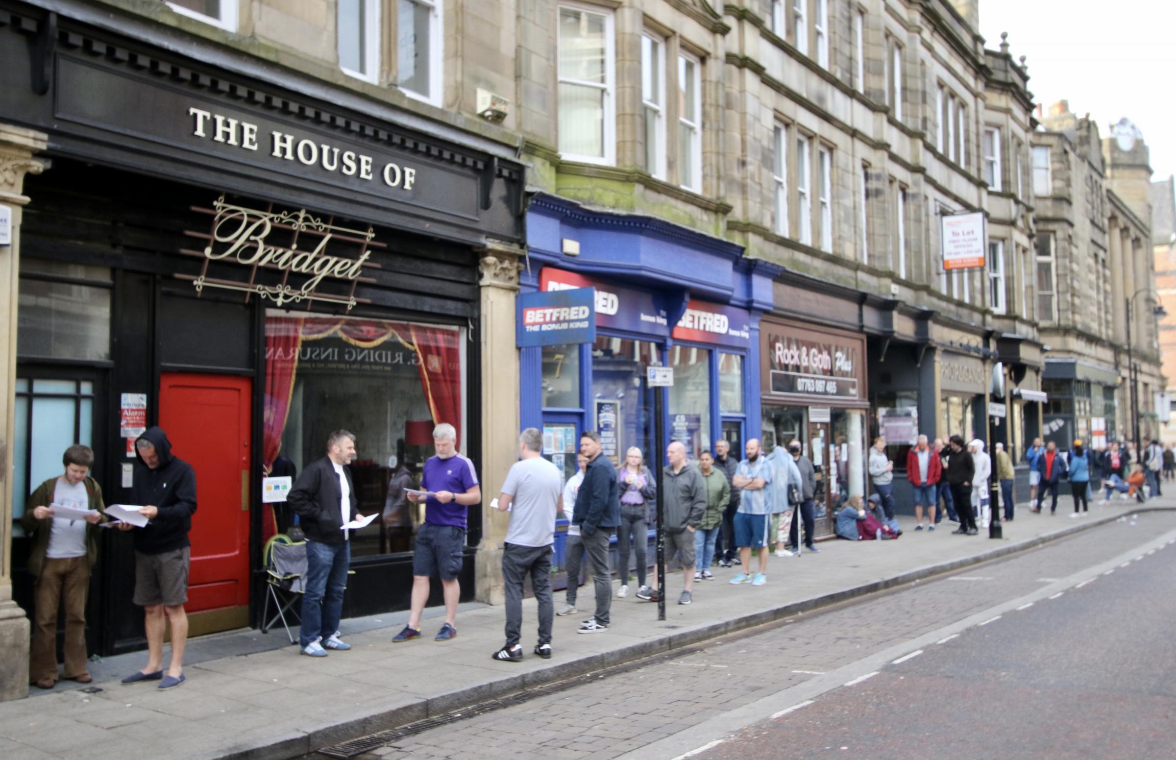 People queue outside Wax and Beans for National Record Day. Picture Danny Crompton