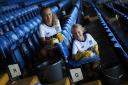 Bury FC fans Ella and Millie Smith help clean up the stadium.