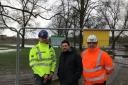 Lee Rawlinson, Environment Agency Area Director for Greater Manchester, Merseyside and Cheshire, Councillor Rhyse Cathcart and Steve Hamer, Project Manager at BAM Nuttall at Close Park, Radcliffe following the flooding