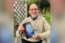 Author Michael Knaggs with a copy of The Blue Men