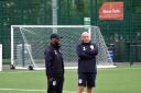 ARRIVAL: Co-boss Lee O’Brien (right) chats to new coach Melford Knight