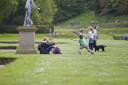 Picture of visitors and their dog at Studley Royal Water Garden. See PA Feature GARDENING Dog. Picture credit should read: Chris Lacey/National Trust Images/PA. WARNING: This picture must only be used to accompany PA Feature GARDENING Dog.