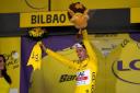 Adam Yates pulled on the yellow jersey after beating twin brother Simon to the line in Bilbao (Thibault Camus/AP)