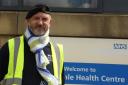 Veteran Steve Butterworth with a specially made scarf in Falkland Islands colours (Credit: Catherine Smyth Media)