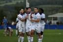 Bury FC players celebrate a goal during Tuesday night’s 2-1 win at Padiham Picture: Phil Hill