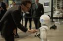 Viscount Camrose, Minister for AI and Intellectual Property meets humanoid robot Pepper at Manchester University Engineering Building on August 30 (Picture: DSIT)