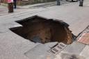 The sinkhole which opened up on Heywood Road in Prestwich on Monday, July 17