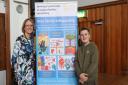 Chief Executive Lynne Ridsdale with Bury's Youth Mayor, Family Safeguarding Banner inbetween them displaying children's artwork