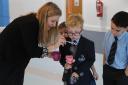 Sara Yates helping Bury Grammar School primary pupils with fun 'learning to breath' activities during her visit