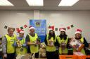 Bolton School pupils helped Lions' members with the sorting and bagging of hundreds of toys in the festive appeal. Some  are pictured here with Sandra and John Crompton from the Lions, extreme left and second left, and Christine Seager extreme right
