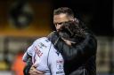 Ian Evatt gives Jack Iredale a hug after the final whistle