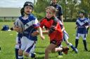 Bury Broncos newly-formed under-7s rugby league team, in blue, take their first run out at Philips High School in Whitefield against Cadishead Rhinos. The youngsters had a fun-filled morning with parents encouraging all the kids as they learned new