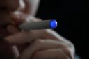 Posed picture of a person smoking an e-cigarette.Anthony Devlin/PA Wire.