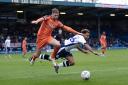 FALL GUY: Bury forward Nicky Maynard goes flying under pressure from Luton Town midfielder Jack Stacey during the FA Cup second-round match at Gigg Lane on Sunday. Pictures by Andy Whitehead Photography